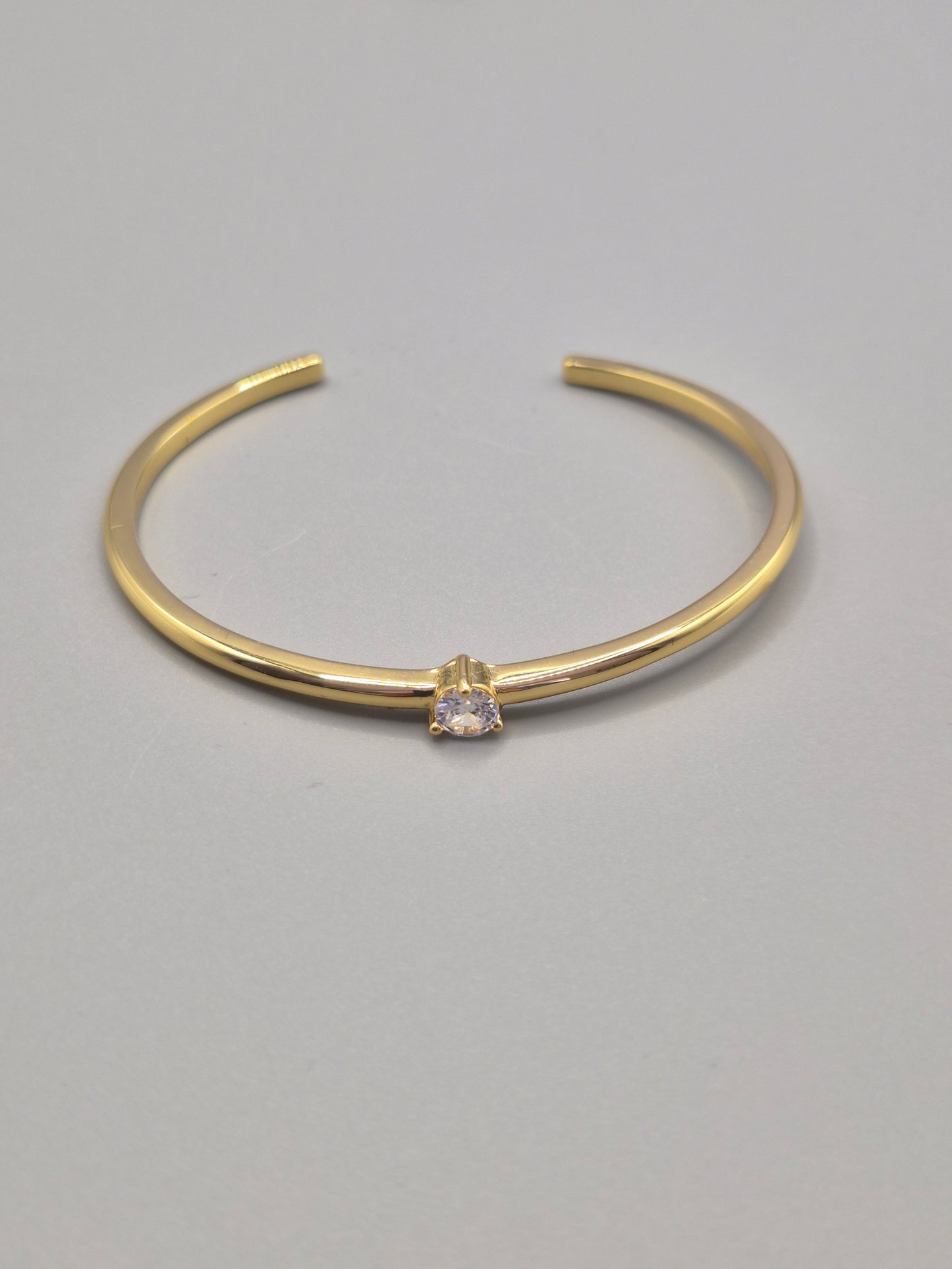 Torque Bangle Claw Set With Single Cubic Zirconia Yellow Coloured