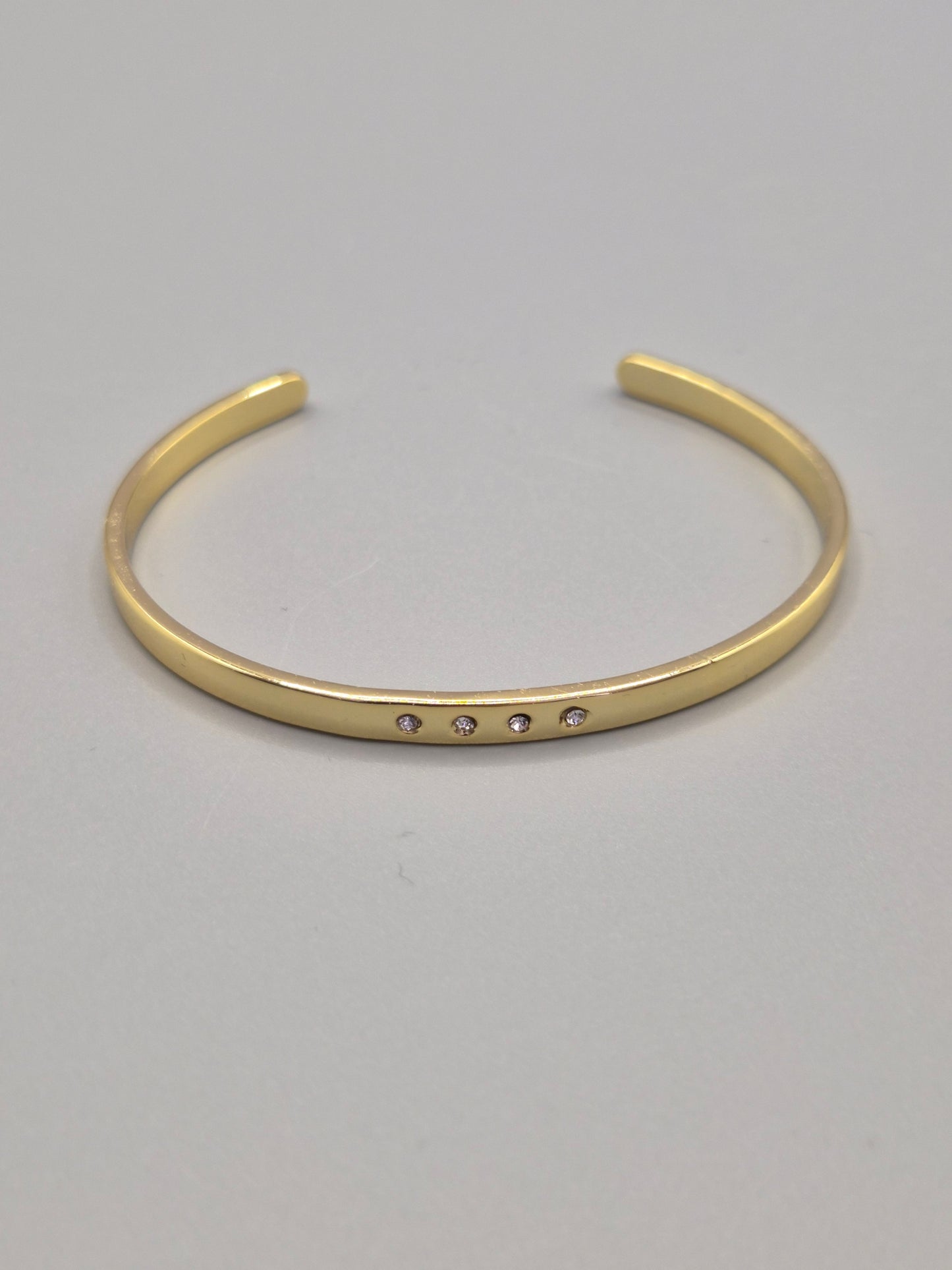 Torque Bangle With 4 Flush Set Cubic Zirconias - Yellow