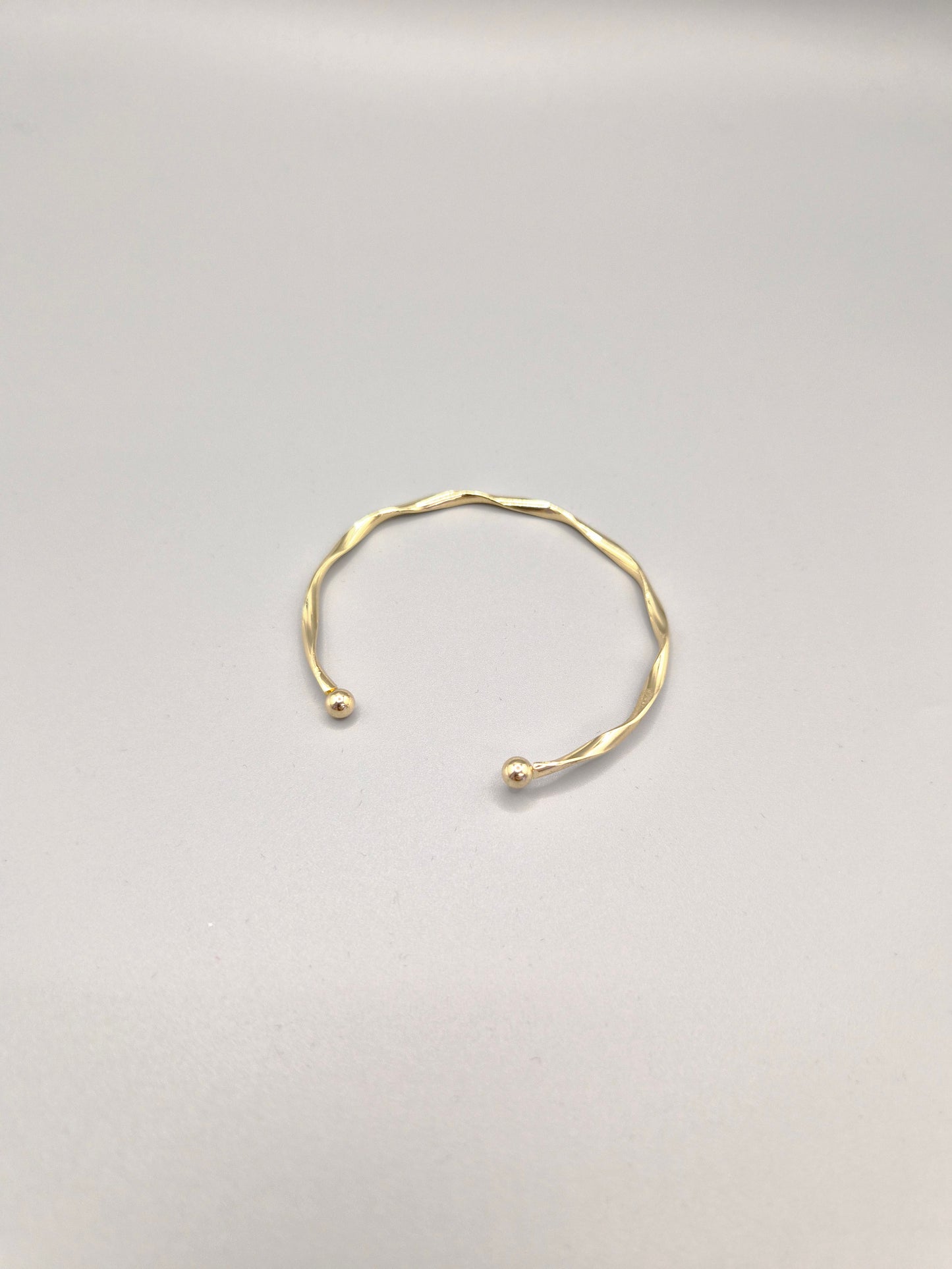 Torque Hammer Effect Gold Coloured Bangle