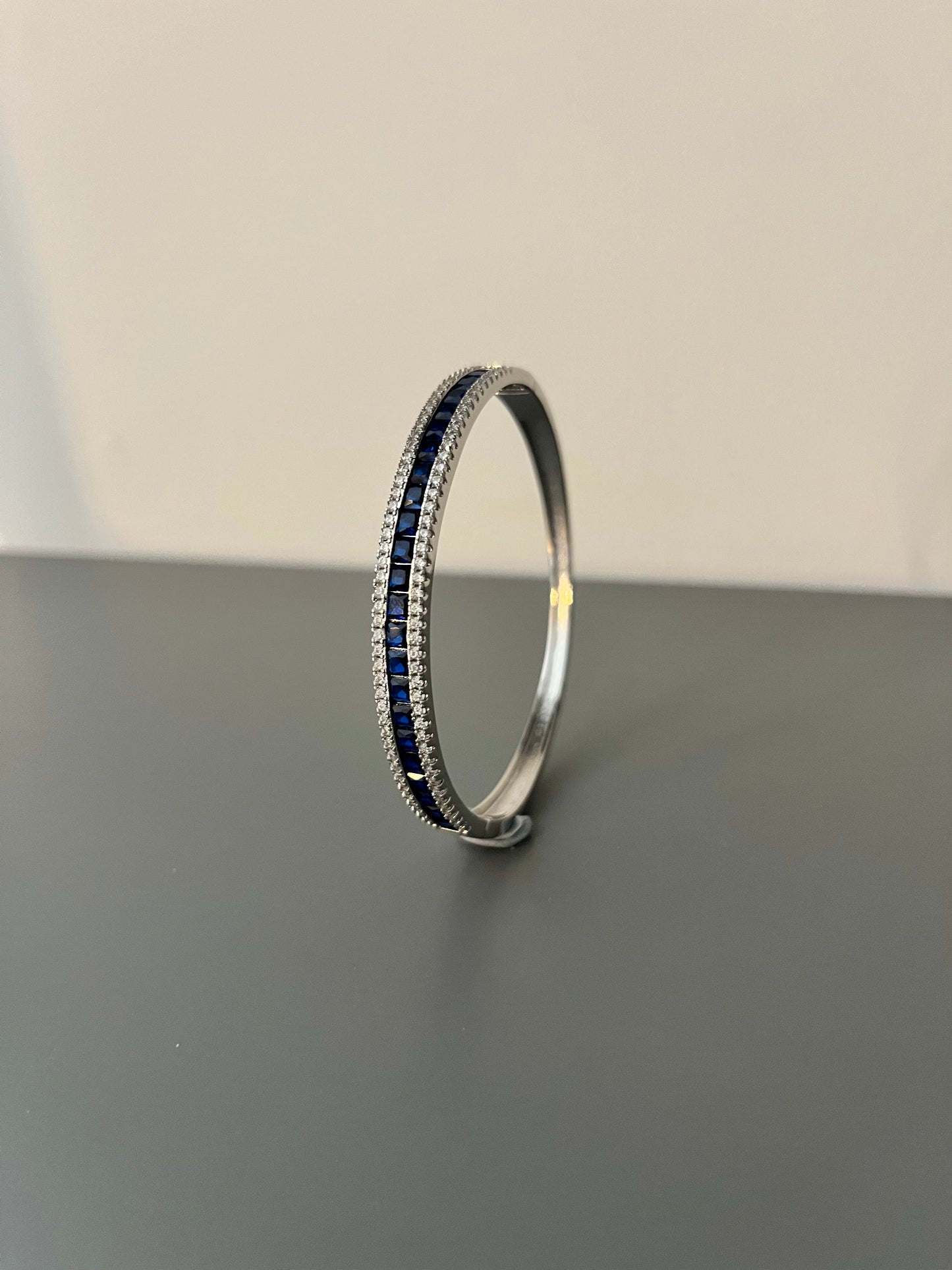 Trilogy Round Cubic Zirconia & Princess Cut Blue Stone Bangle