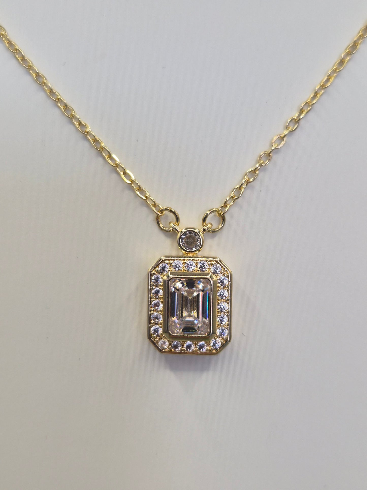 Emerald Cut Centre Stone & Round Brilliant Cut Cubic Zirconia Pendant - Yellow