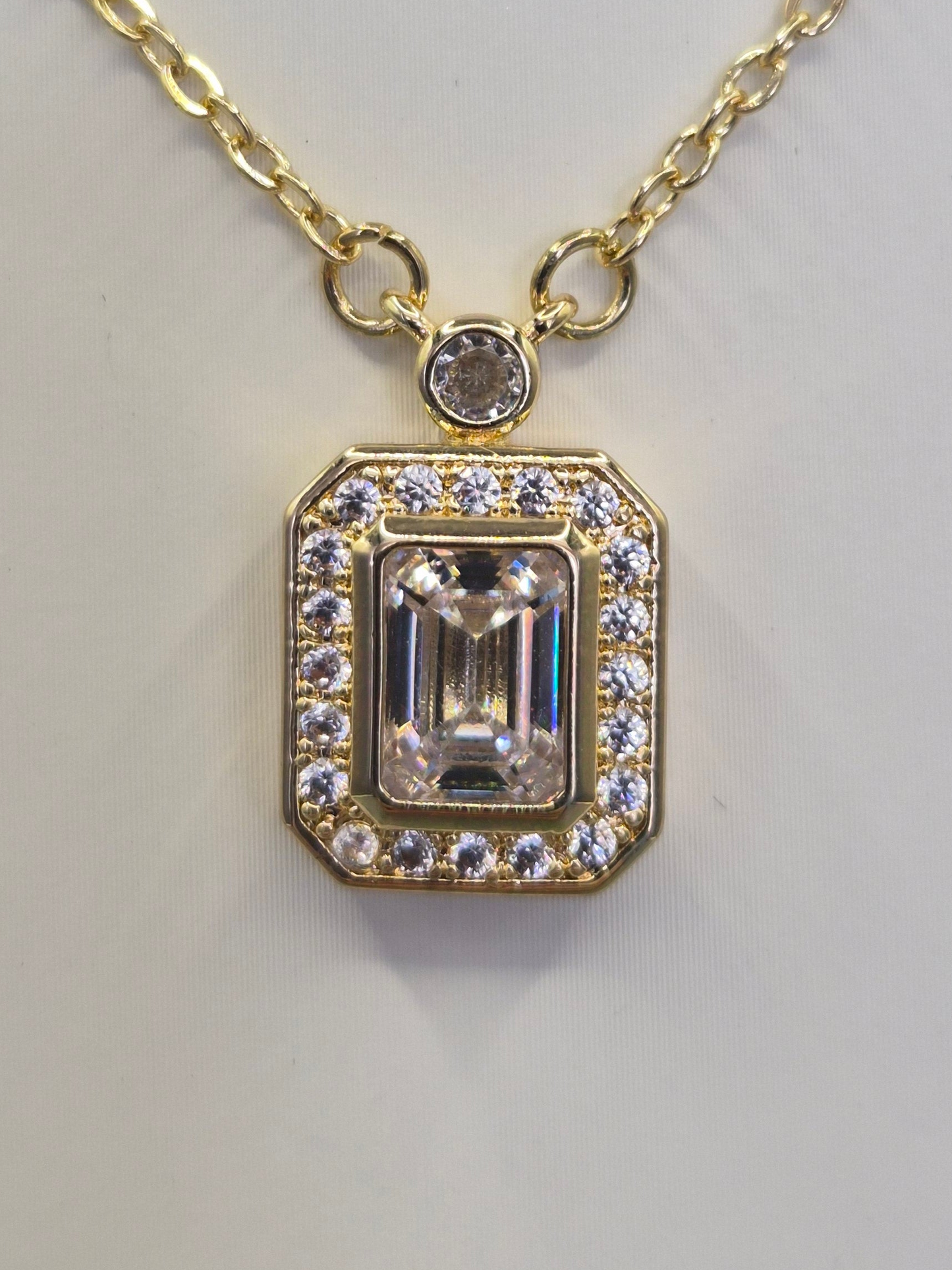 Emerald Cut Centre Stone & Round Brilliant Cut Cubic Zirconia Pendant - Yellow