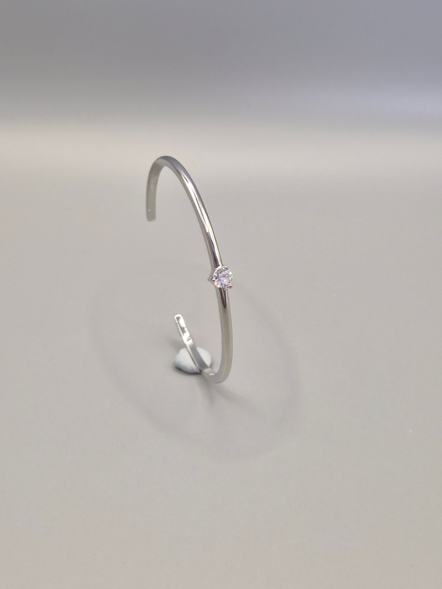 Torque Bangle Claw Set With Single Cubic Zirconia Centre Stone Silver Coloured