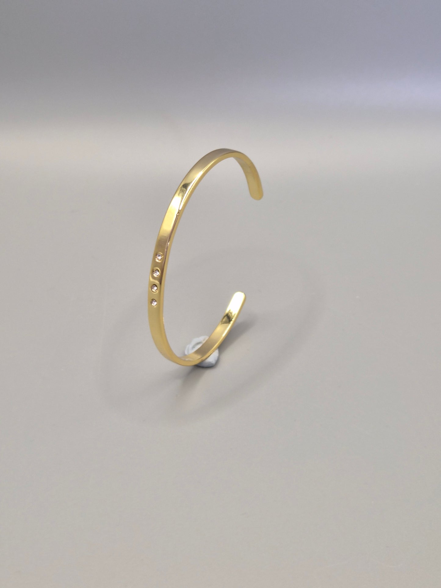 Torque Bangle With 4 Flush Set Cubic Zirconias - Yellow