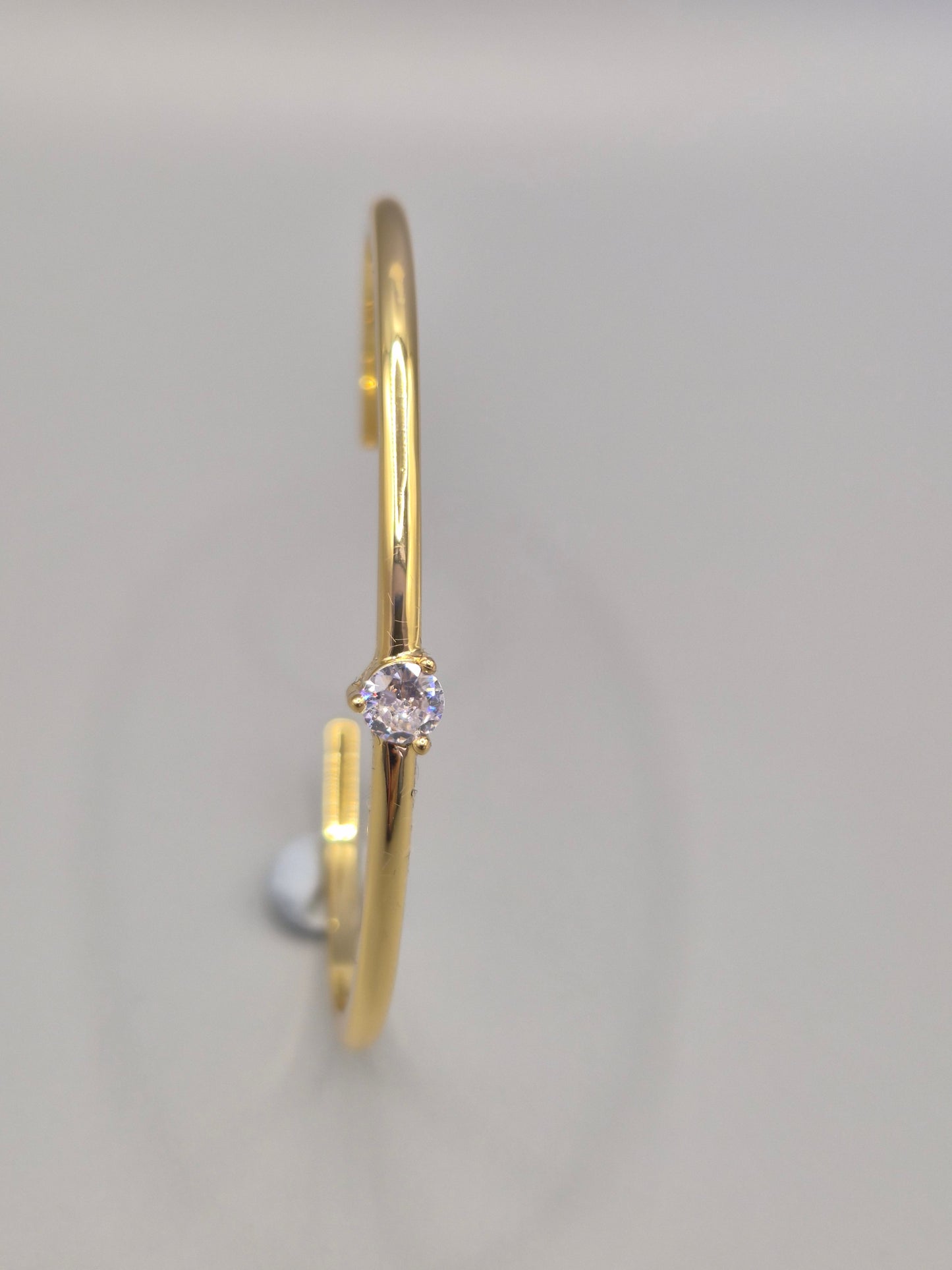 Torque Bangle Claw Set With Single Cubic Zirconia Yellow Coloured