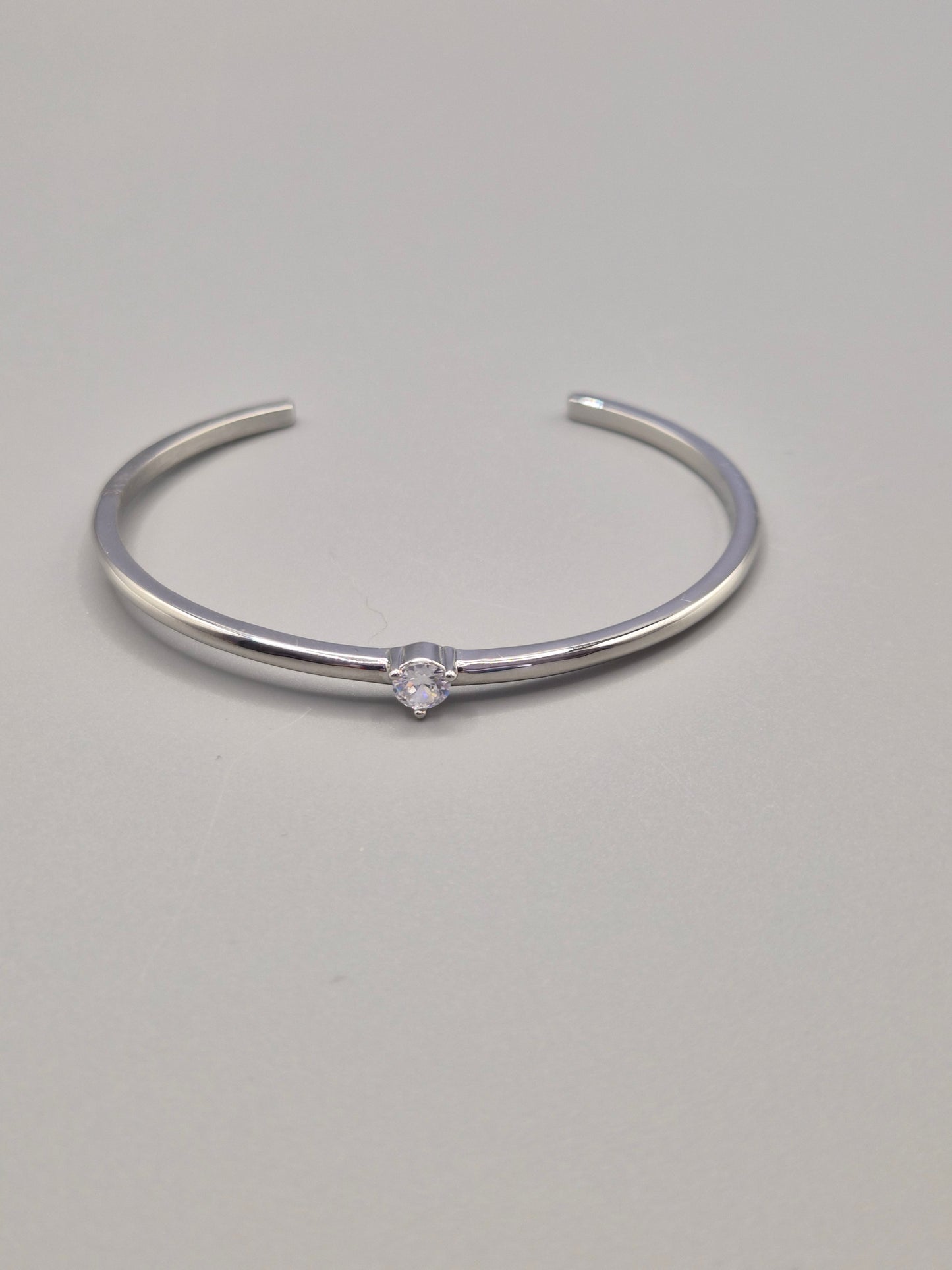 Torque Bangle Claw Set With Single Cubic Zirconia Centre Stone Silver Coloured
