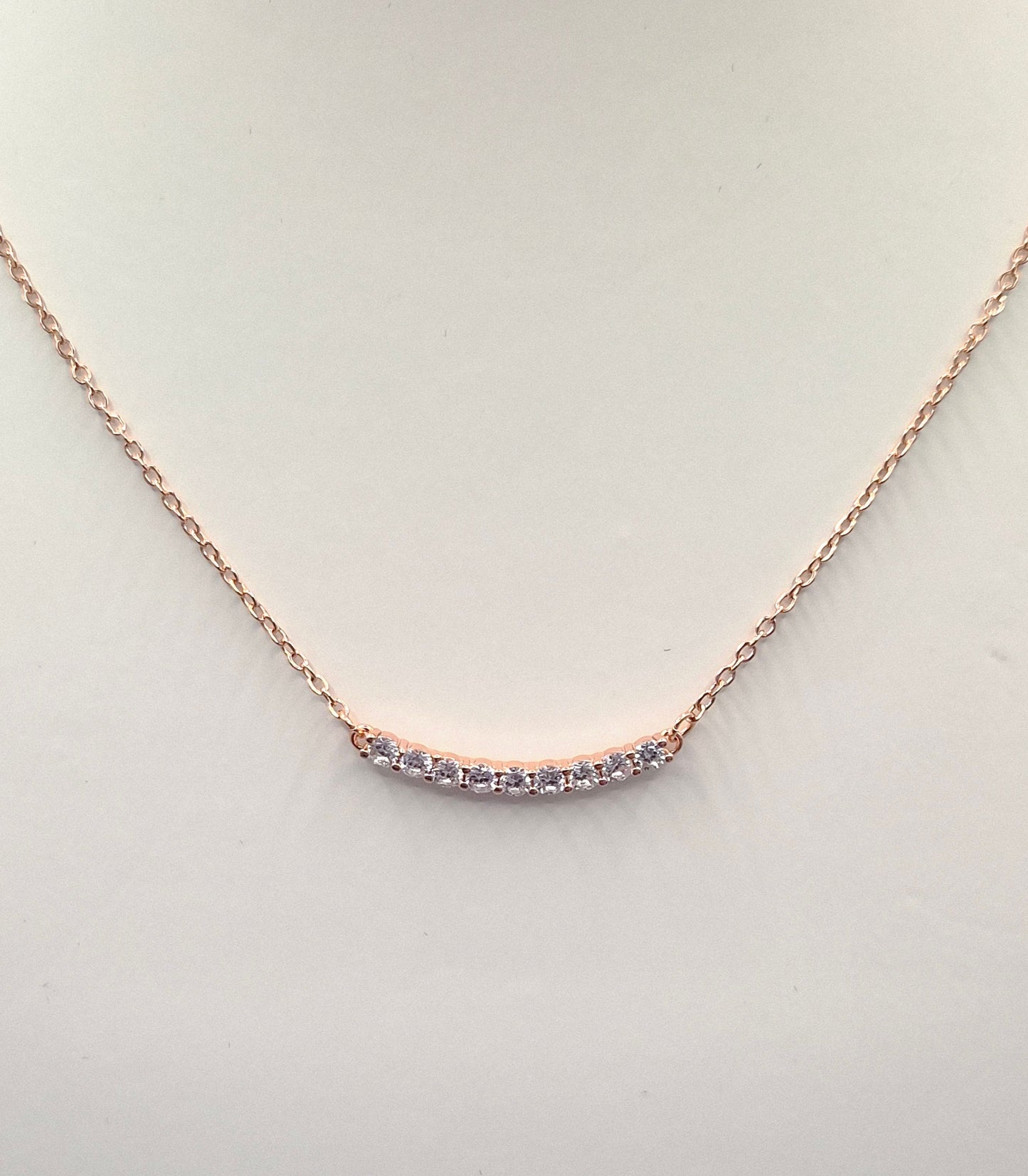 9 Stone Curve Cubic Rose Coloured  Zirconia Pendant