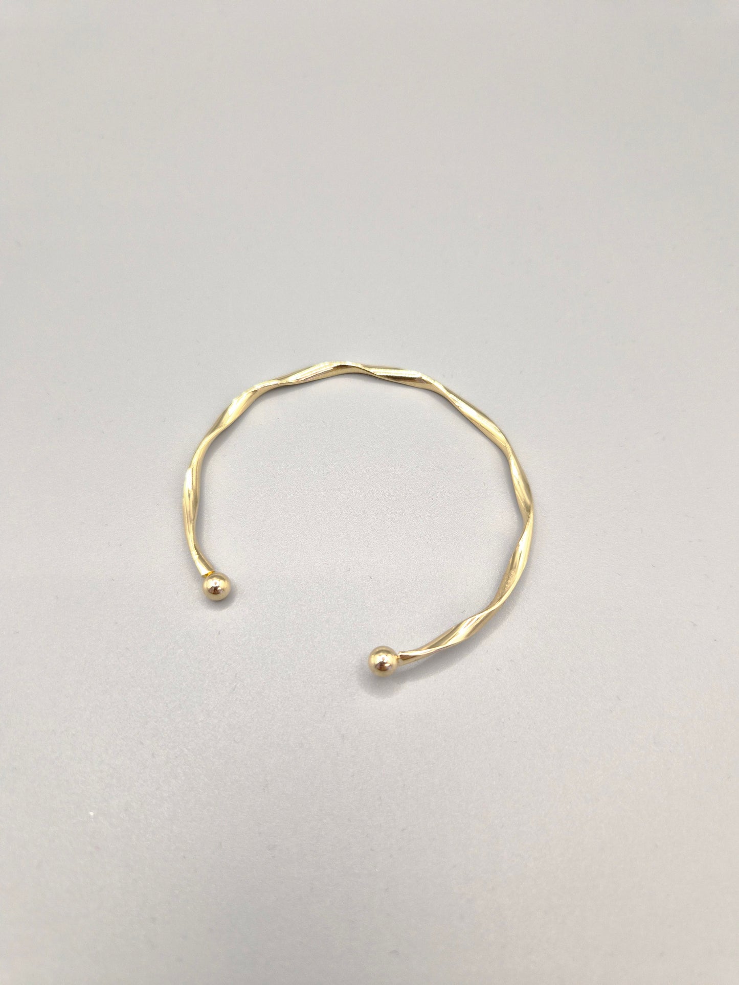 Torque Hammer Effect Gold Coloured Bangle