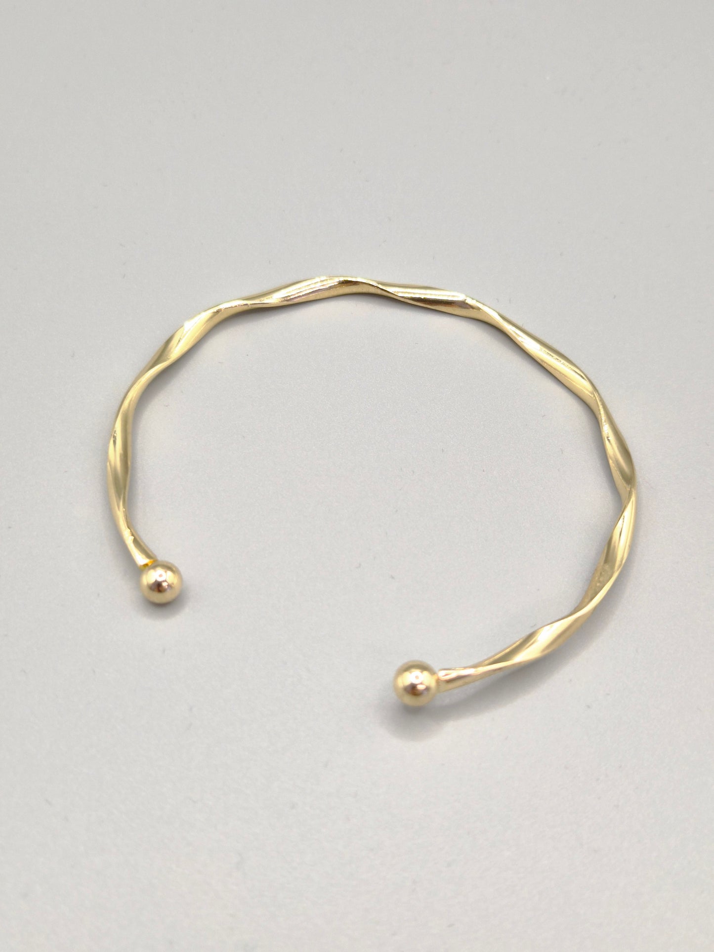 Torque Hammer Effect Gold Coloured Bangle