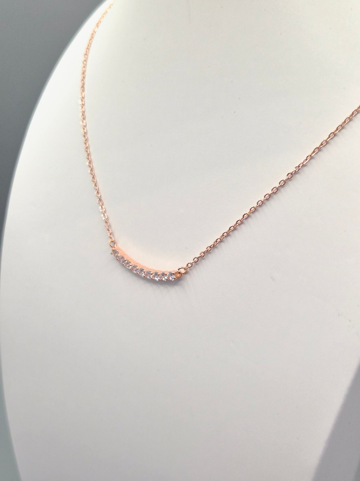 9 Stone Curve Cubic Rose Coloured  Zirconia Pendant