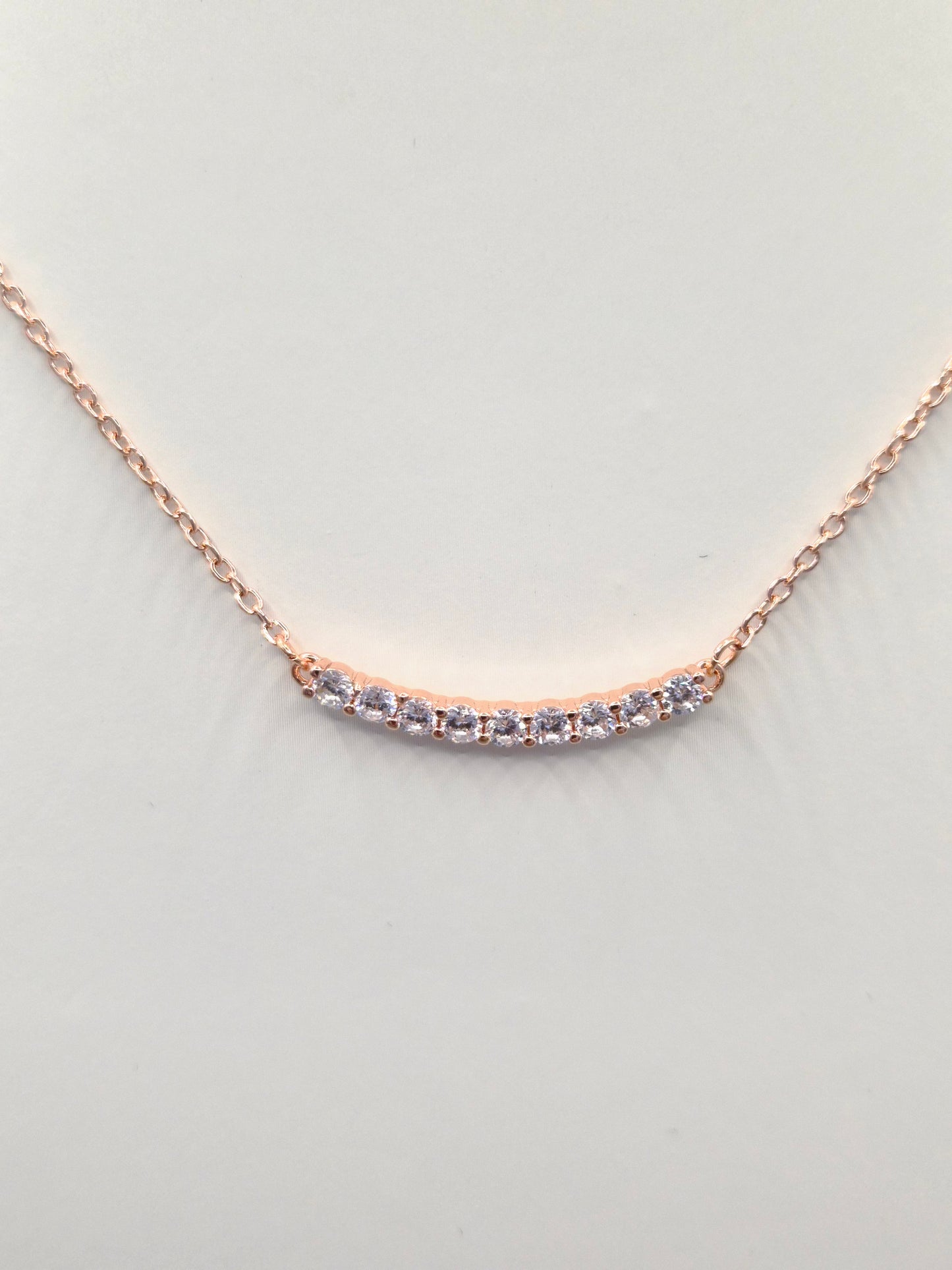9 Stone Curve Cubic Rose Coloured  Zirconia Pendant