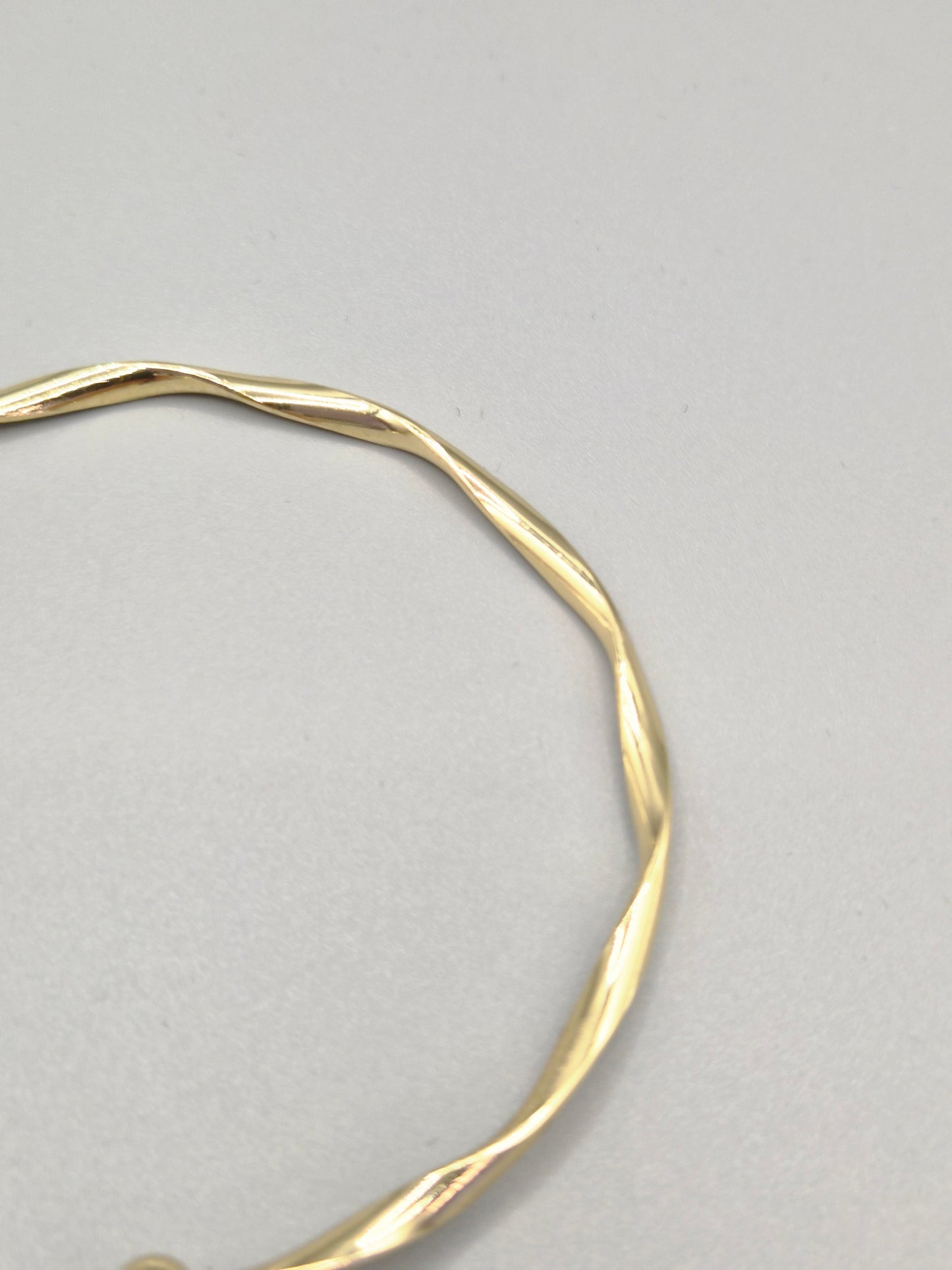 Torque Hammer Effect Gold Coloured Bangle