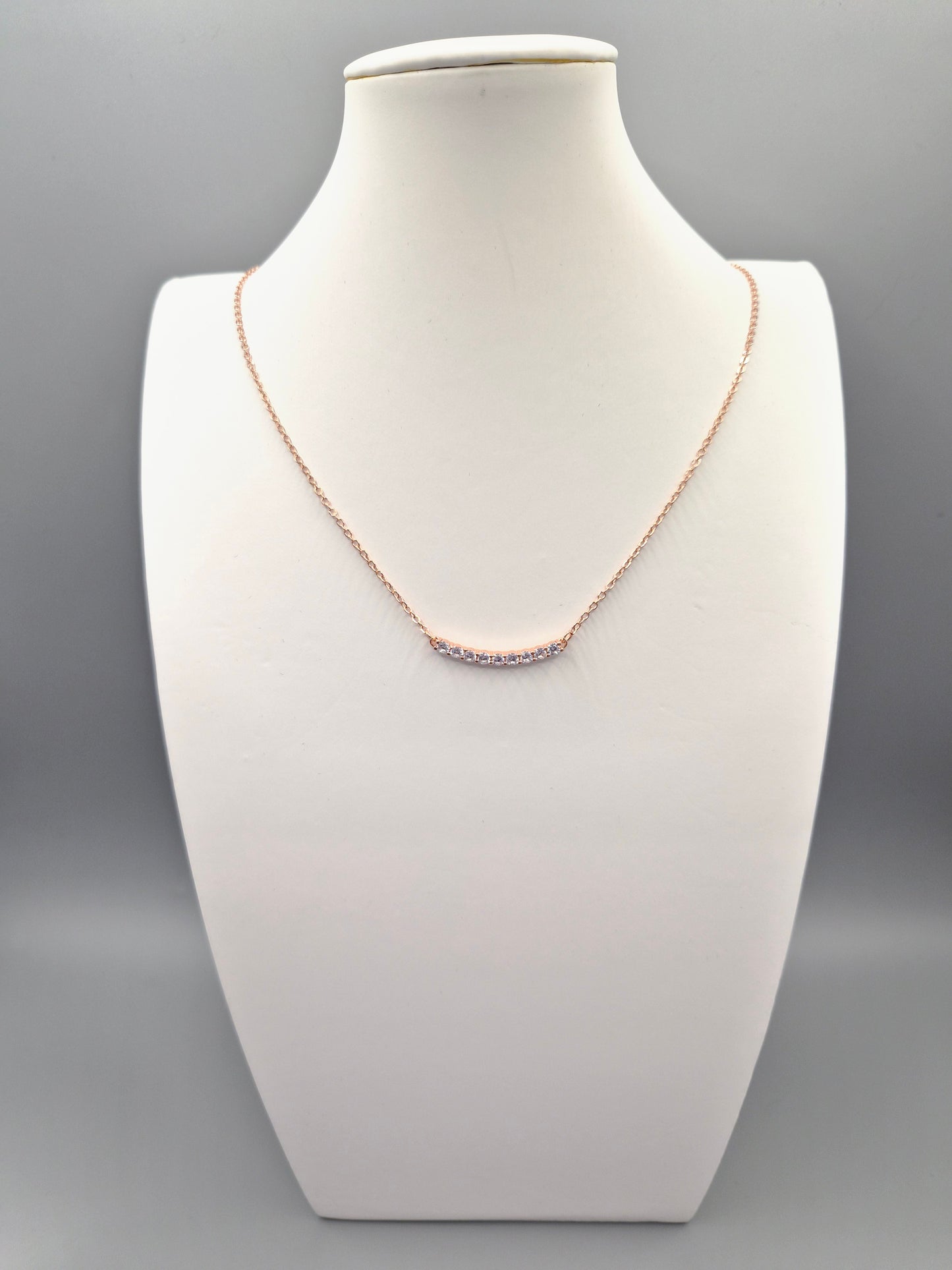 9 Stone Curve Cubic Rose Coloured  Zirconia Pendant