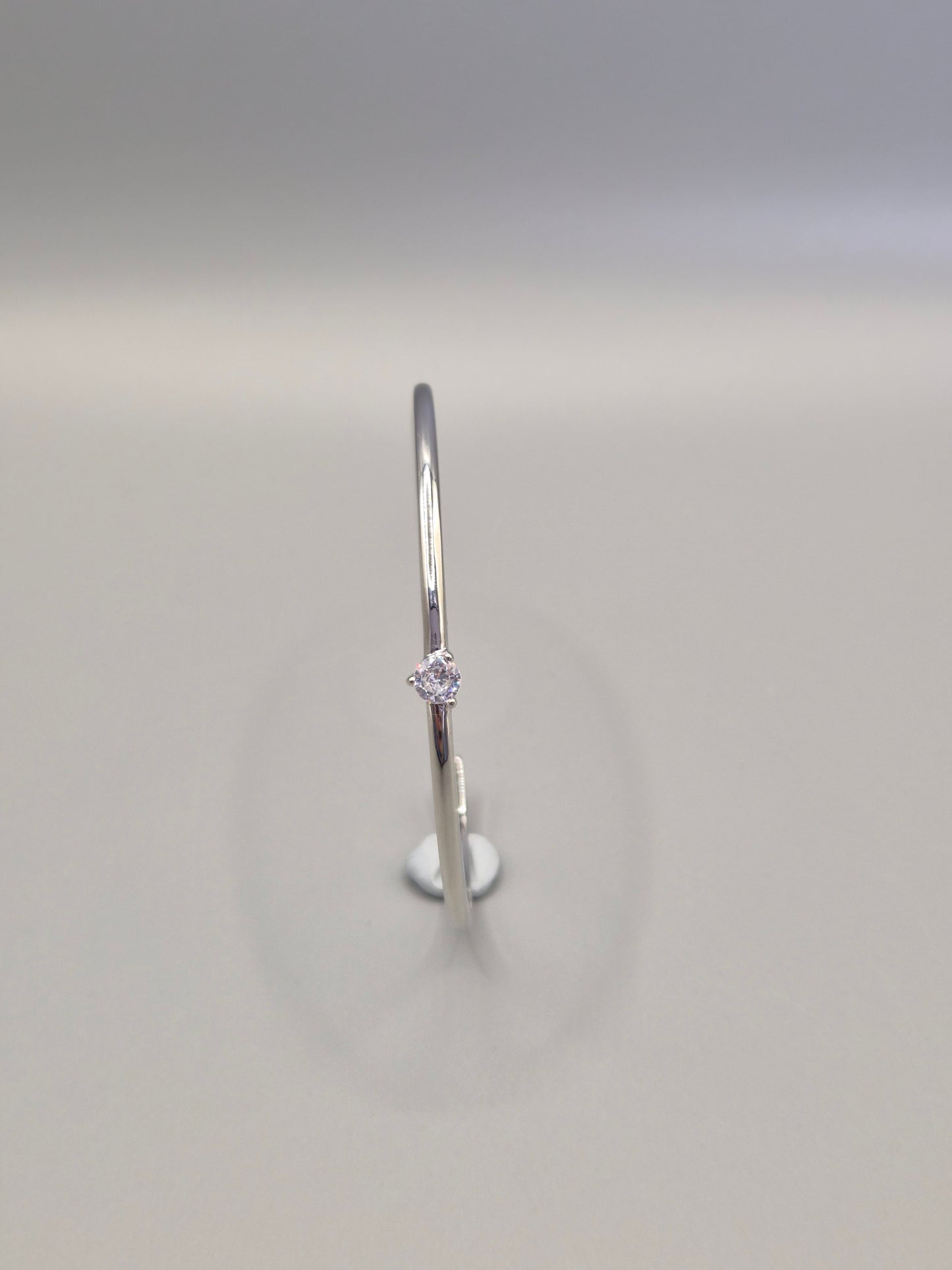 Torque Bangle Claw Set With Single Cubic Zirconia Centre Stone Silver Coloured